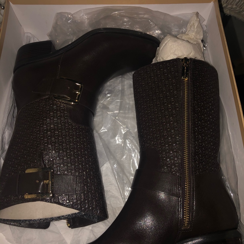 Michael kors brown boots with gold buckle.